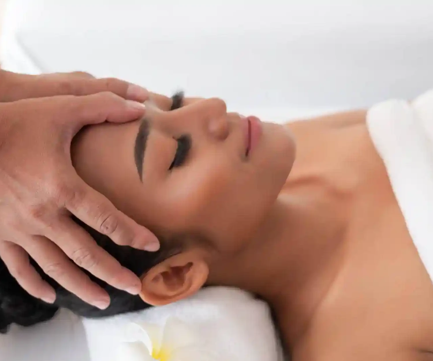 Woman receiving head massage